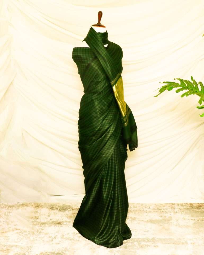 A Gaji Silk saree in bottlegreen colour with minimal designs from Uddup Silk, Chennai.