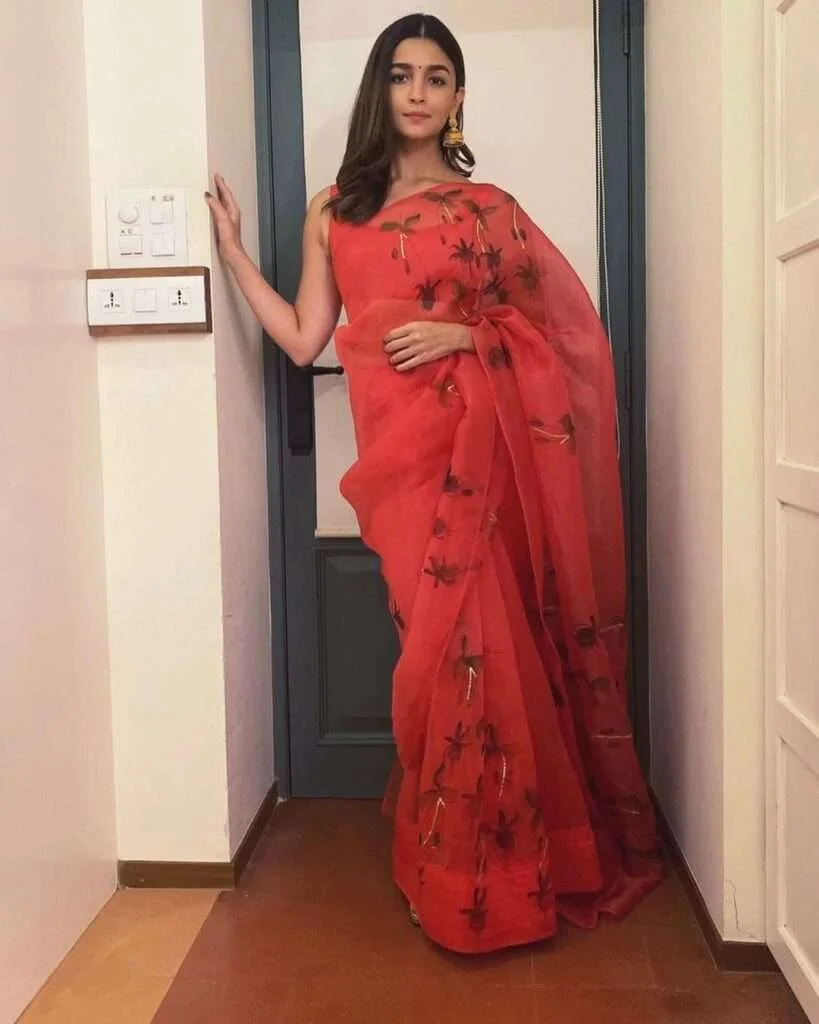 Celebrity icon Alia Bhatt in Organza Saree with a sleeveless blouse