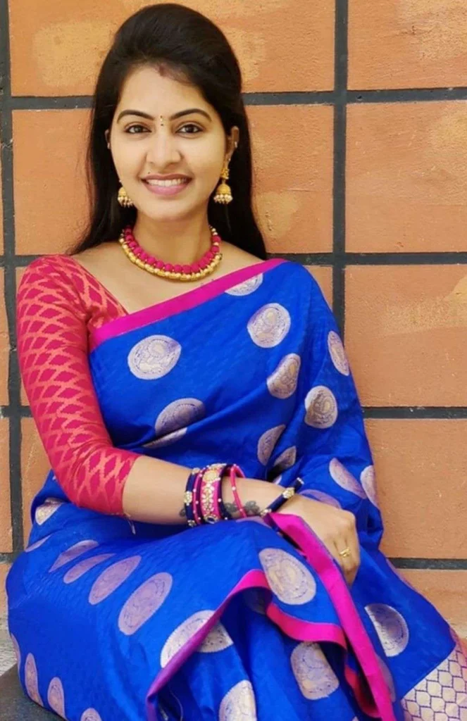 Blue Saree with a Contrast Blouse in Pink with matching makeup & jewellery