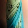 Pastel Green Shade styled with blue border and blouse Georgette saree